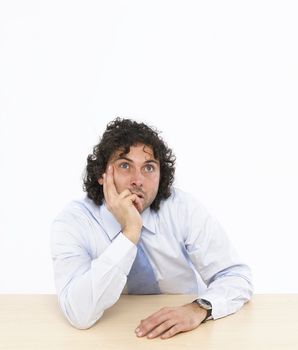 businessman think sitting at his desk isolated on white background