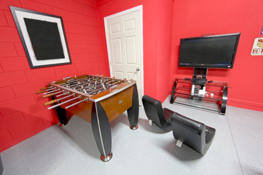 A Games Room with Foosball, TV and Gaming Chairs