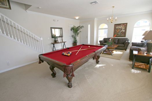 A Pool Table in a Living Area in a Home