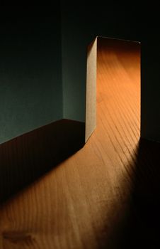 Dark room with open door made from paper