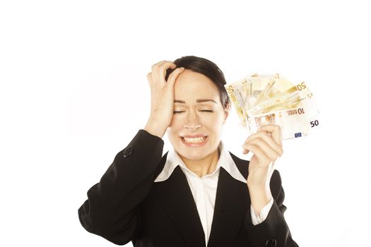 Photo of a depressed young business woman holding currency notes 