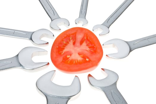 Cut tomato and wrench isolated. Clipping path