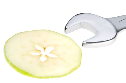 Cut apple and wrench isolated. Clipping path