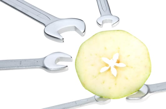 Cut apple and wrench isolated. Clipping path