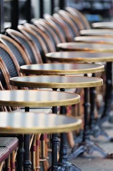 Chairs and tables in the street cafe in Paris