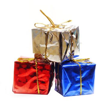 Holiday gift boxes decorated with ribbon isolated on white background.