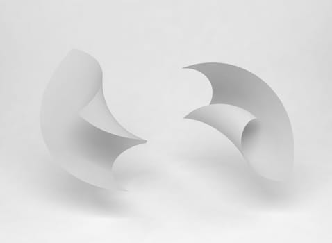 Two paper sheets blowing around in the air