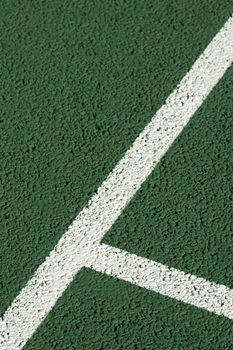 lines on a concrete tennis court