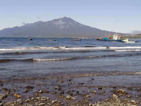 Landscapes of Kuriles, boats in the sea