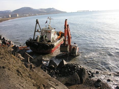 Landscapes of Sakhalin, the ship and tractor in the sea