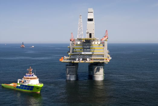 Landscapes of Sakhalin, the ship against an oil derrick