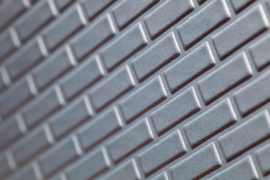 A wall formed by metal bricks