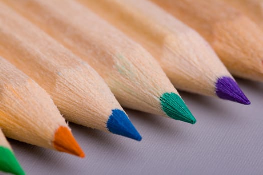 A composition of pencils of wood in a variety of colors