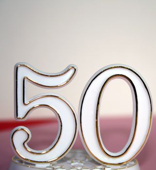 50th occasion sign over pink