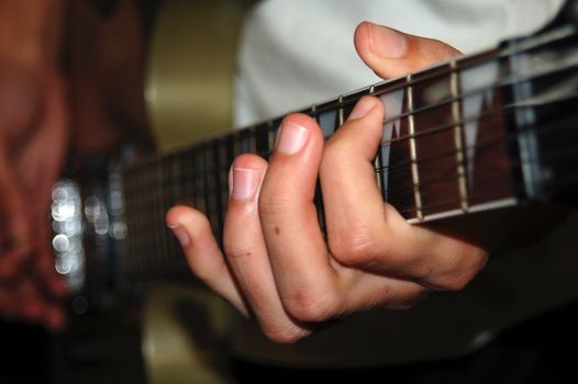 Pair of Hands Playing Electric Guitar