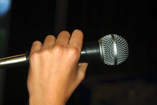 Hand Holding Vocal Microphone