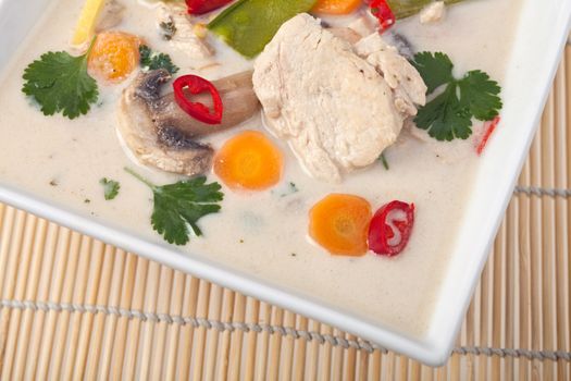 thai tom kha gai soup in a bowl