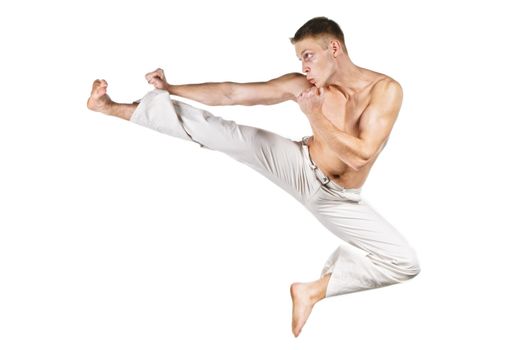 Kickboxer punching, isolated on white background.