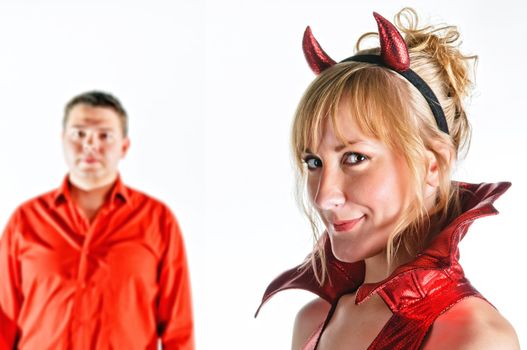 Red devil couple on white background