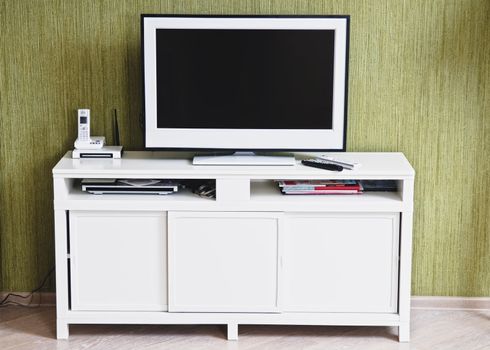 White TV-set in modern stylish home interior