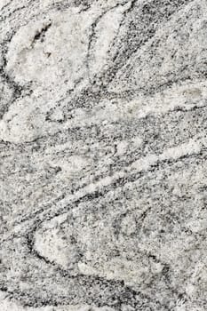 Raw natural stone - a gray granite background