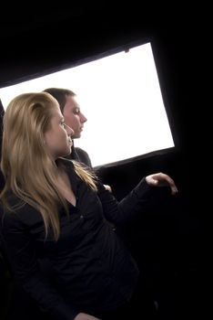 Young couple against the white screen