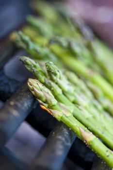 steak and asparagus on a charcoal grill short focus