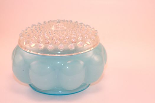 Antique women's powder jar cosmetic dish with hobnail lid. Beauty, cosmetics and fashion for women.