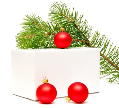 festive balls with gift box on white