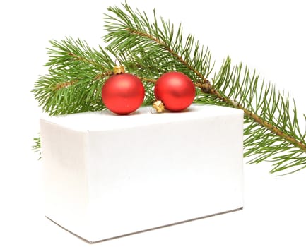festive balls with gift box on white