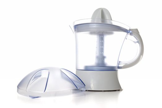 Modern juice extractor isolated on a white background.