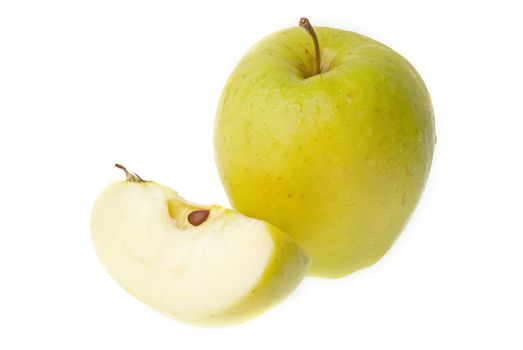 A half and a whole fresh green apple isolated on white background.