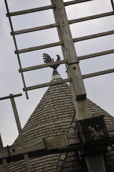 Weathercock of vintage wind mill in Brittany, France