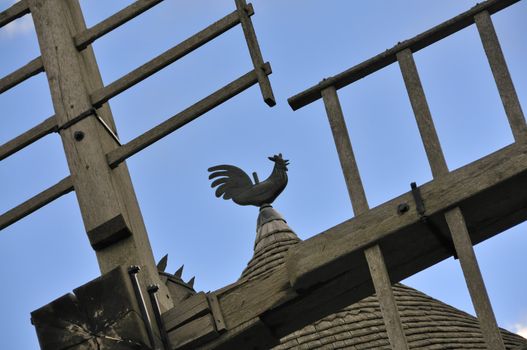 Weathercock of vintage wind mill in Brittany, France