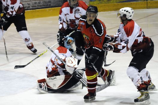 ZELL AM SEE, AUSTRIA - NOVEMBER 28: Salzburg hockey League. Unterberger gets crosschecked by Devils player. Game between SV Schuettdorf and Devils Salzburg  (Result 2-13) on November 28, 2010, at the hockey rink of Zell am See