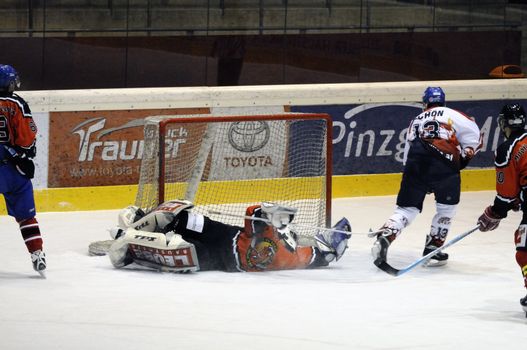 ZELL AM SEE, AUSTRIA - NOVEMBER 28: Salzburg hockey League. Schoen scores for Salzburg in the third period. Game between SV Schuettdorf and Devils Salzburg  (Result 2-13) on November 28, 2010, at the hockey rink of Zell am See