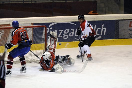 ZELL AM SEE, AUSTRIA - NOVEMBER 28: Salzburg hockey League. Great save by Schuettdorf Goalie Peter Hochwimmer. Game between SV Schuettdorf and Devils Salzburg  (Result 2-13) on November 28, 2010, at the hockey rink of Zell am See