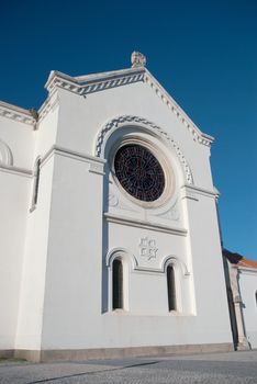 Portuguese church view agains blue clear sky.