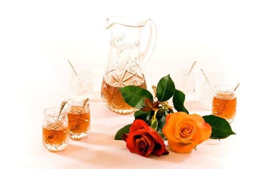 Turkish crystal teaset with can, tiny glasses and roses on white background