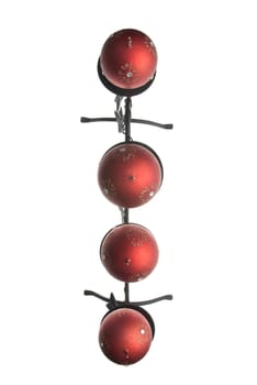 Christmas decoration with red wax candles on a white background.