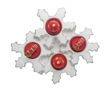 Christmas decoration with red wax candles on a white background.