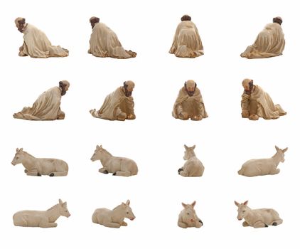 Christmas crib isolated on white statuettes representing a King and a donkey.