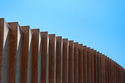 Abstraction of curves for modern building on a clear blue sky.