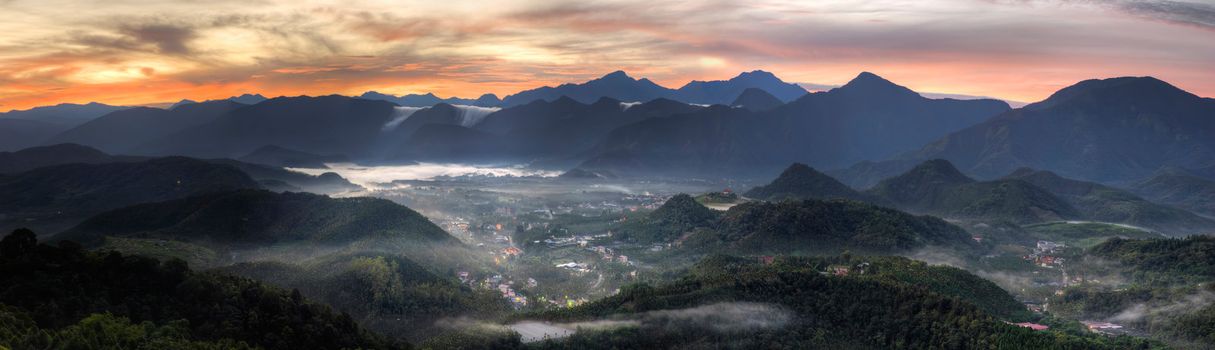 Panoramic rural scenery sunrise with samll town in hill and forest, Taiwan, Asia.