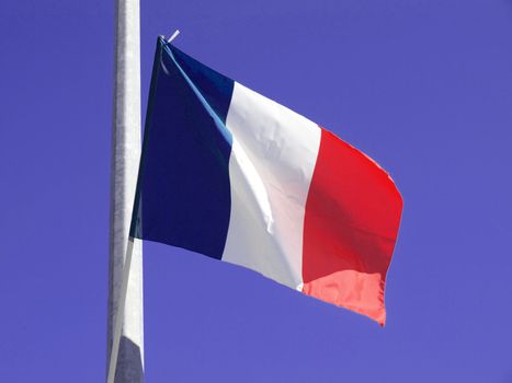 Flag of France over blue sky background