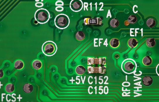 Electronic background - a green computer circuit board close up