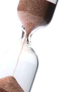 Extreme closeup of hourglass isolated on white background
