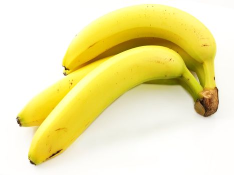 Group of bananas, connected towards white background