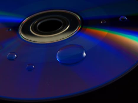 Digital colorful disk isolated towards dark background