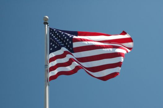 An American flag flaps in the wind.